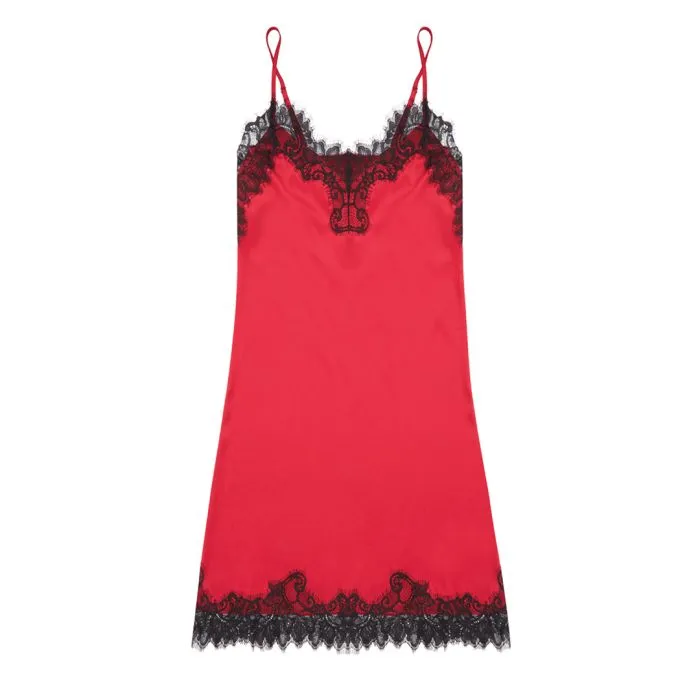 Close-up of a red satin slip with detailed black lace trim